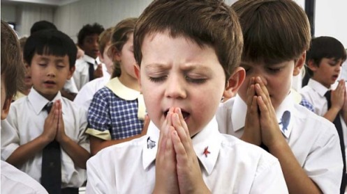 student praying
